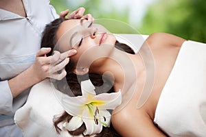 Spa salon: Young Beautiful Woman Having Facial Massage