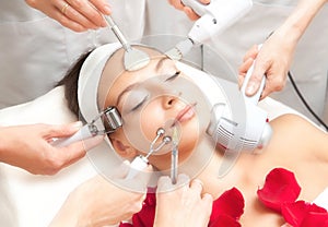 Spa Salon: Young Beautiful Woman Having Various Facial Treatment