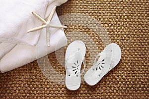 Spa sandals on sea-grass mat