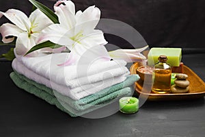 Spa set with soft towels, candles, bath oil