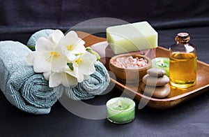 Spa set treatments products with flower, towels, oil salt , soap