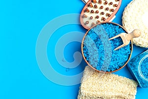 Spa setting with blue salt and sponge