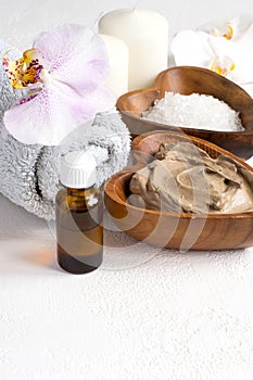 Spa setting with cosmetic clay mask for body and face, Towel and