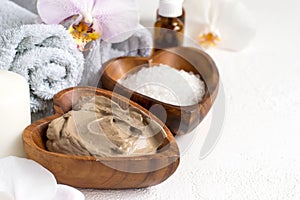Spa setting with cosmetic clay mask for body and face, Towel and