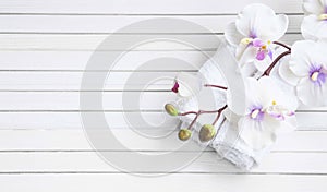 SPA setting with orchid flower and towels, overhead shot