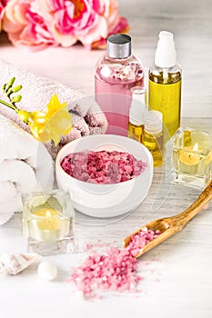 Spa setting with pink roses and aroma oil, vintage style