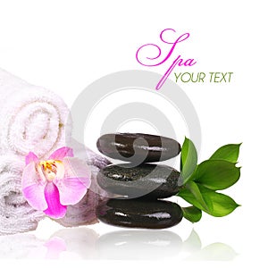 Spa setting. Spa Stones and Pink Orchid Flower with Green Leaves