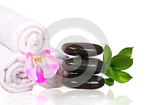 Spa setting. Spa Stones and Pink Orchid Flower with Green Leaves