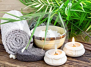 Spa Setting wiht Green Leaves and Burning Candles