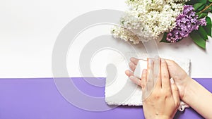 SPA soap banner. Aromatic natural soap with lilac flowers onwhite background, top view