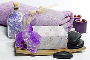 Spa soap with towel and orchids