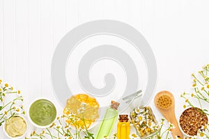 Spa still life with aromatherapy chamomile, herbal oil, soap, sea salt