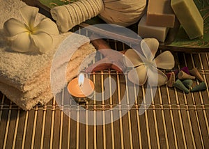 Spa still life with aromatic candles,white flower ,soap and towel