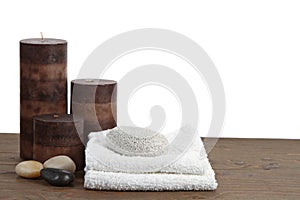 Spa still life candles, pumice stone and towels