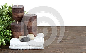 Spa still life with candles, stones and towels