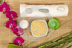 Spa still life with Orchid, candle, salt and towel bamboo