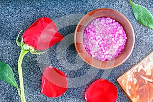 Spa still life with roses, sea salt, soap on ceramic tile. Relax time concept