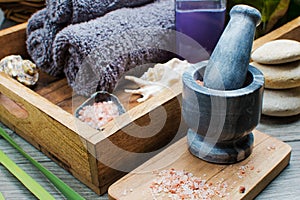 Spa still life with seashells, towels and sea salt in a mortar and pestle