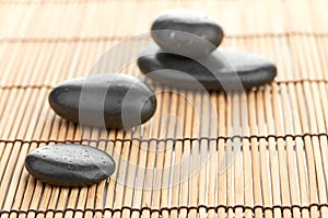 The spa a stone on bamboo background