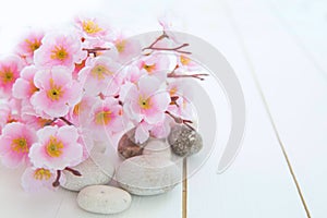 Spa stones with pink sakura flowers