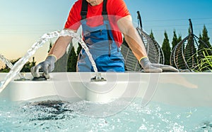 Spa Technician Performing Hot Tub Checks photo