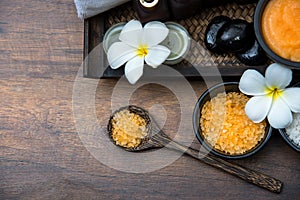 Spa Thai setting for aroma therapy and sugar and salt massage with flower on the bed, relax and healthy care