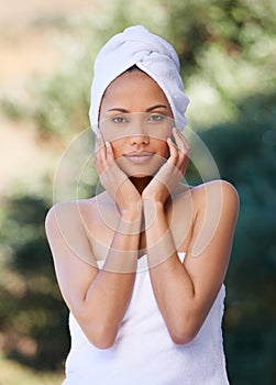 Spa, touch face and woman outdoor in towel for beauty, healthy skincare and body wellness. Relax, portrait and person at