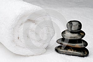 Spa towel with dark spa stones