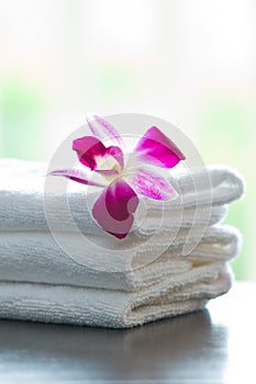 Spa towels and orchid flowers