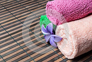 Spa towels rolls and flower.