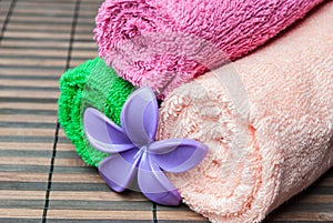 Spa towels rolls and flower.