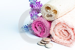 Spa towels rolls, flower and stones.