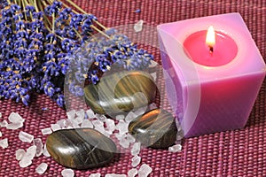 Spa treatment: aromatherapy candle, seasalt and massage stone photo