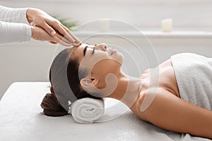 Spa Treatment. Calm Asian Woman Enjoying Relaxing Acupressure Head Massage