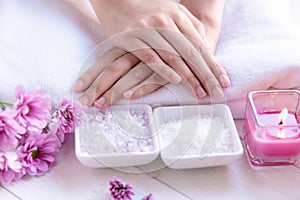 Spa treatment and product for female feet and manicure nails spa with candlelight and pink flower for relax and rest.