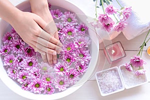 Spa treatment and product for female feet and manicure nails spa with pink flower,