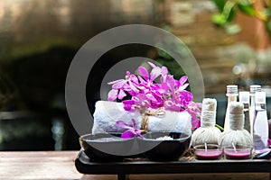 Spa treatment and product for female feet and manicure nails spa with pink flower, copy space, soft and select focus,