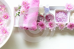 Spa treatment and product for female feet and manicure nails spa with pink flower, copy space, soft and select focus, Thailand.