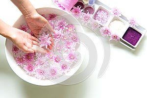 Spa treatment and product for female feet and manicure nails spa with pink flower, copy space, soft and select focus, Thailand