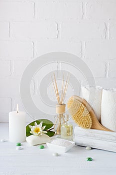 Spa treatment - towels aromatic soap, bath salt, and oil, and accessories for massage