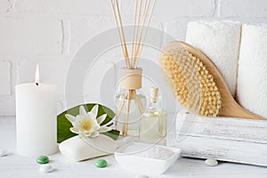 Spa treatment - towels aromatic soap, bath salt, and oil, and accessories for massage