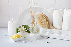 Spa treatment - towels aromatic soap, bath salt, and oil, and accessories for massage