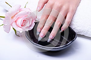Spa treatments for hand nails close-up. Cosmetic procedures for nails in spa salon.
