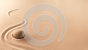 Spa wellness background of a zen meditation garden with sand and round stone