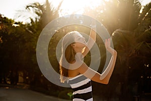 Spa wellness beach beauty woman relaxing and sun bathing on beach. Beautiful serene and peaceful young female model on