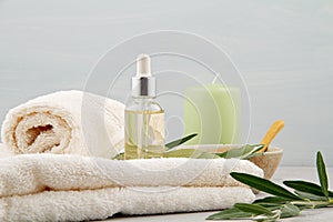 Spa and wellness composition with serum, towels and beauty products