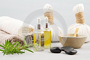 Spa and wellness composition with serum, towels and beauty products