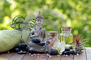 Spa and wellness composition with statuette  of Buddha and zen stones