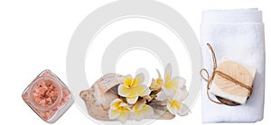 Spa wellness concept with milk soap,pink salt,white towel and plumeria flowers isolated with clipping path on  white background