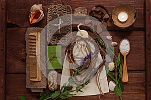 Spa wellness concept, natural coffee scrub, conifer soap in eco bag, coconut shell candle, peeling accessories flat lay